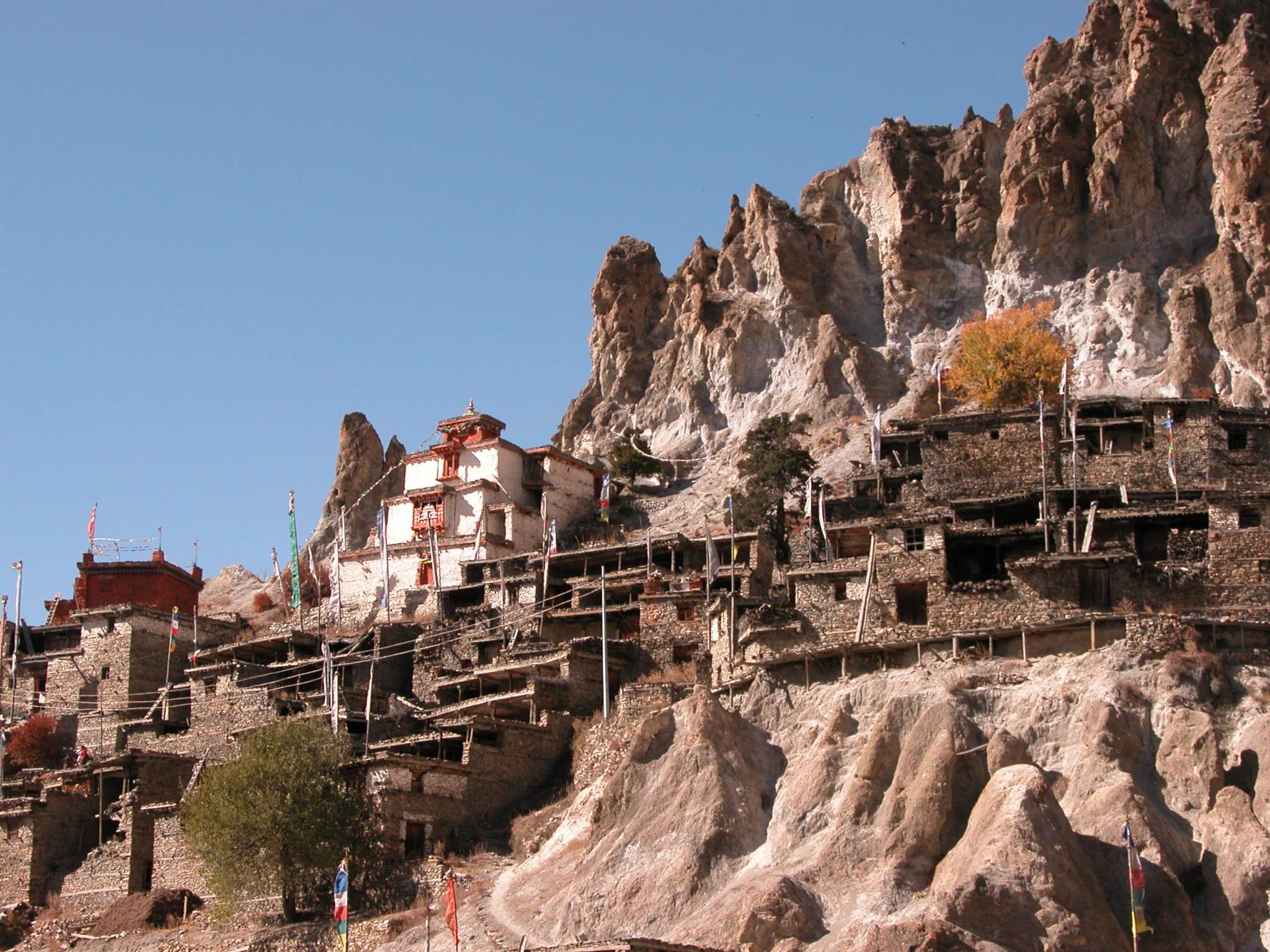 Annapurna 12 10 Braga Braga (3500m) is a Tibetan-style village of about 200 houses hiding behind a photogenic steep, eroded rock outcrop. The houses are stacked one atop the other, each with an open veranda formed by a neighbour�s rooftop. The gompa is perched on a high crag overlooking the village, and is estimated to be 400 to 500 years old. The gompa comprises three main buildings and belongs to the Kagyu sect of Tibetan Buddhism.